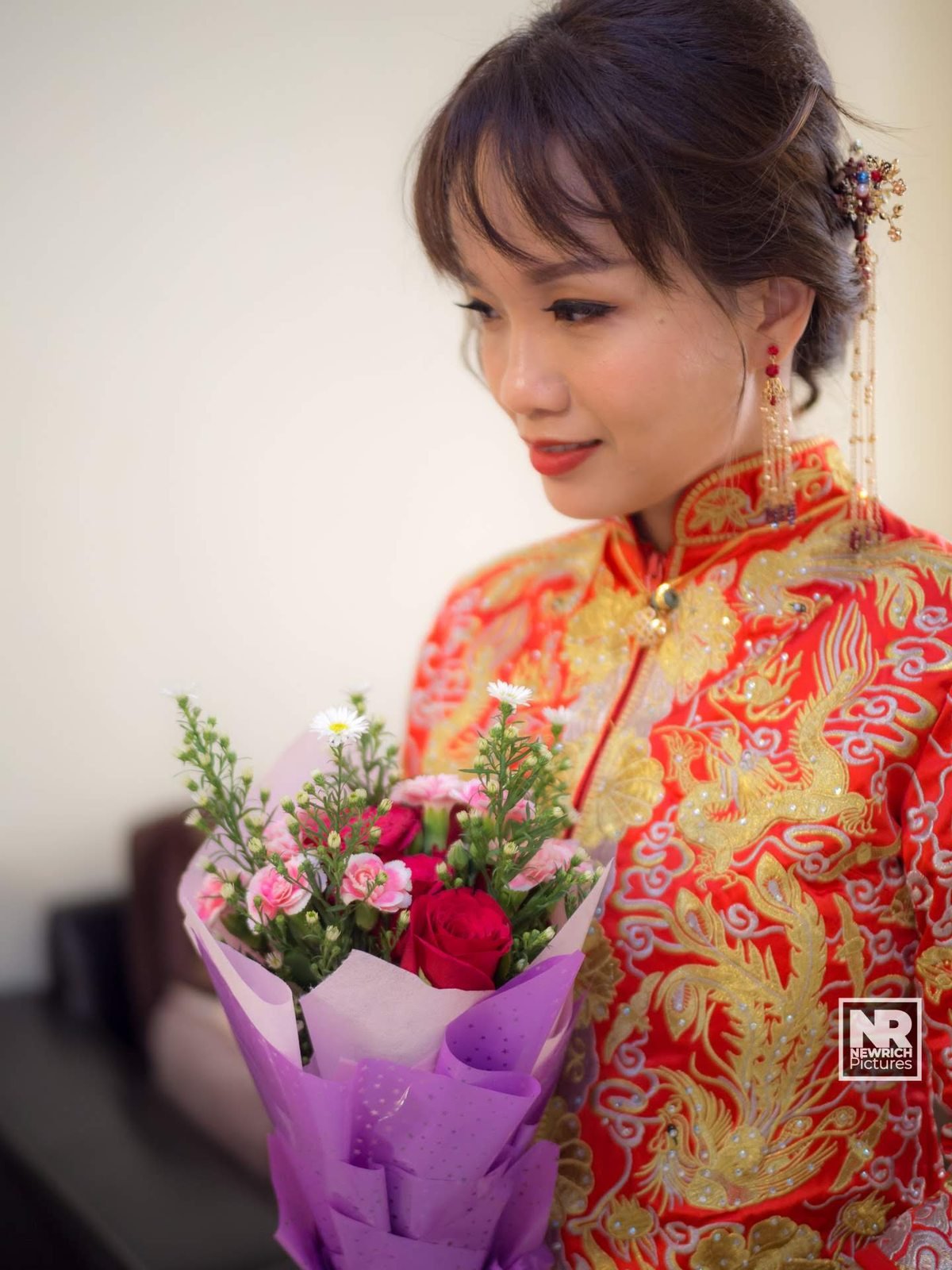Bride Holding Bridal Floral Bouquet with Gold Embroidery